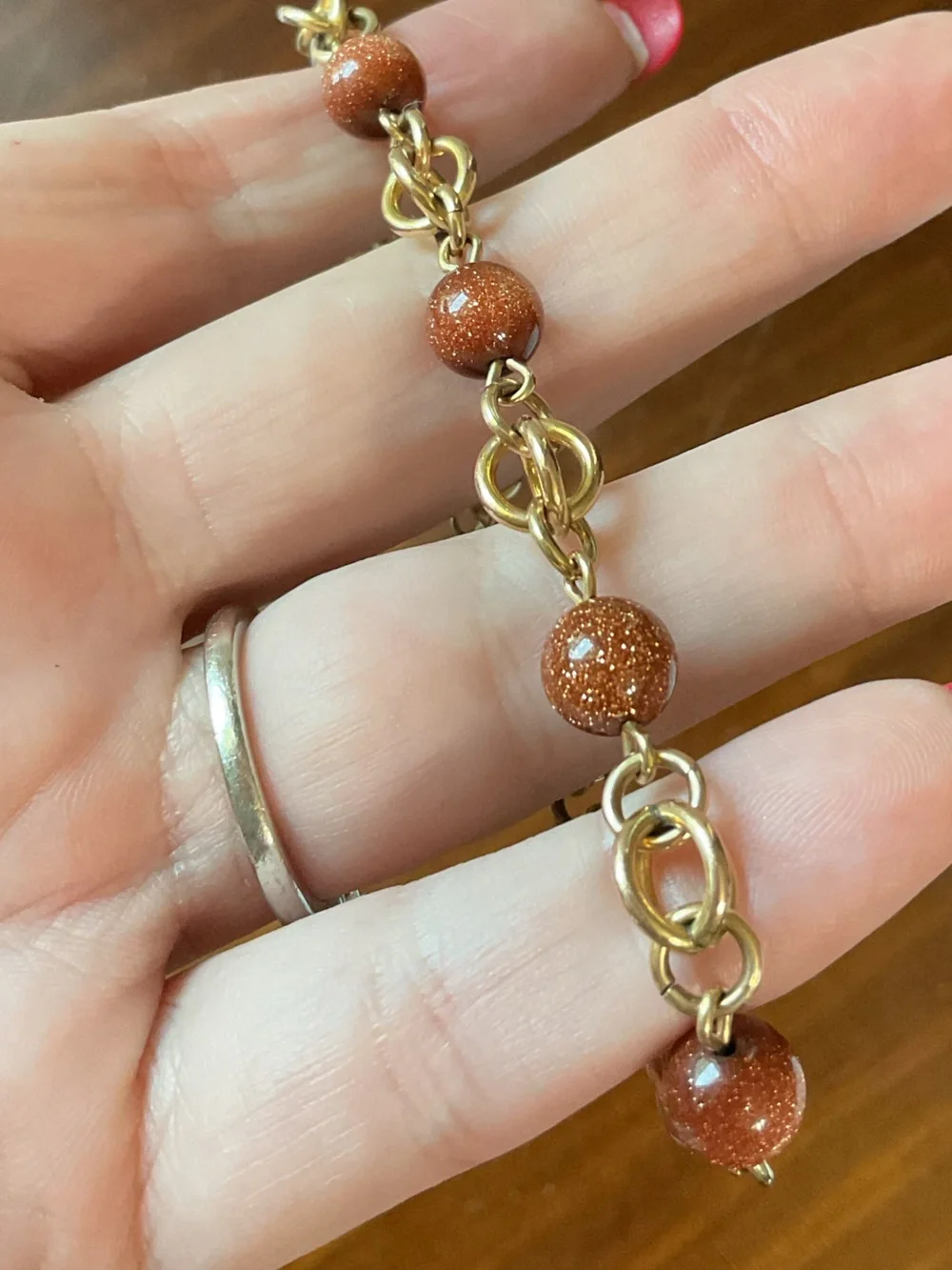 Goldstone and Gold Tone Chain Link Bracelet with Safety Chain Orange